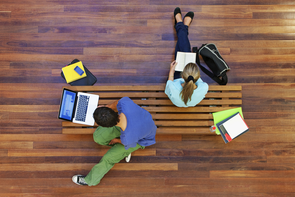 Top,View,Of,Male,And,Female,University,Students,Studying